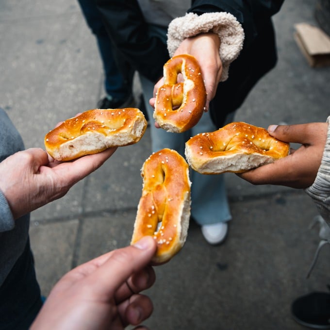 Group holding pretzels