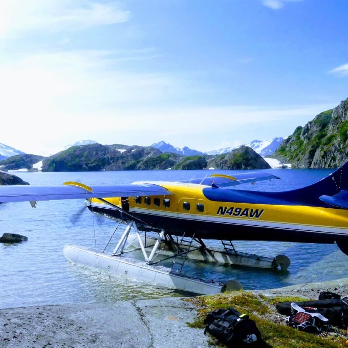 Seaplane on Water with Surrounding Mountains