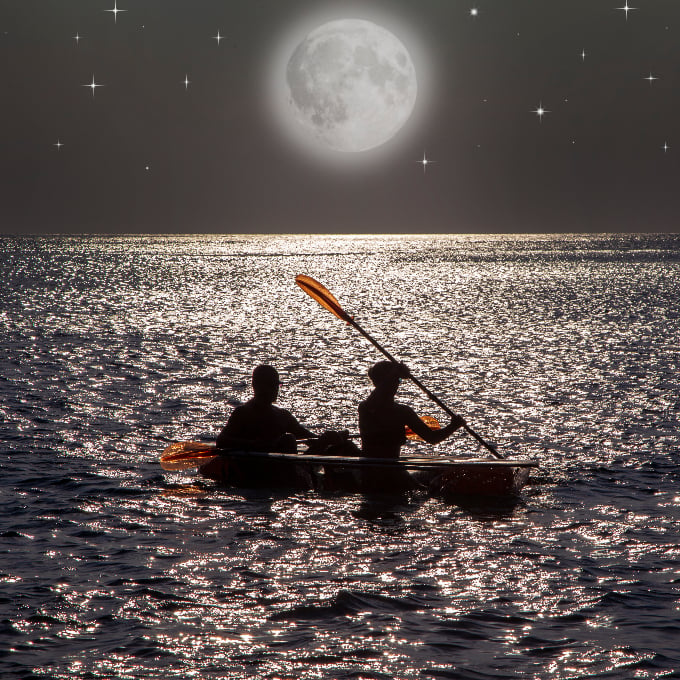 Kayaking at full moon