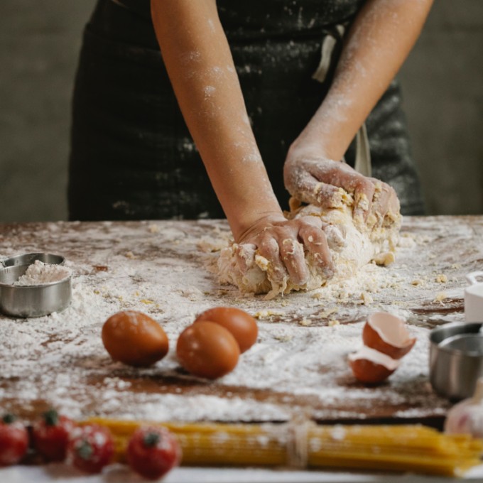 Person making pasta dough