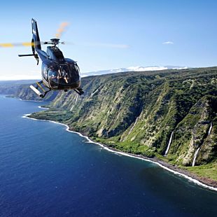 Helicopter flying over coast