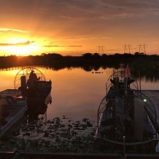 Airboats at dock at sunset