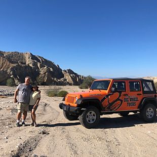 Two people posing with Jeep