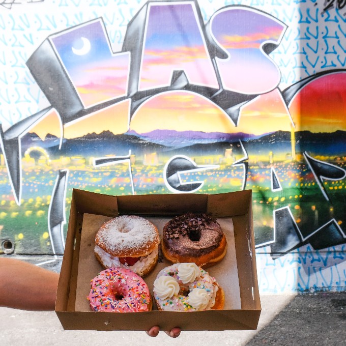 Donuts in front of Las Vegas wall art