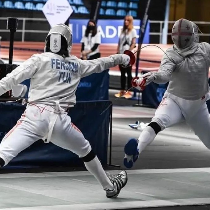 Two People Fencing
