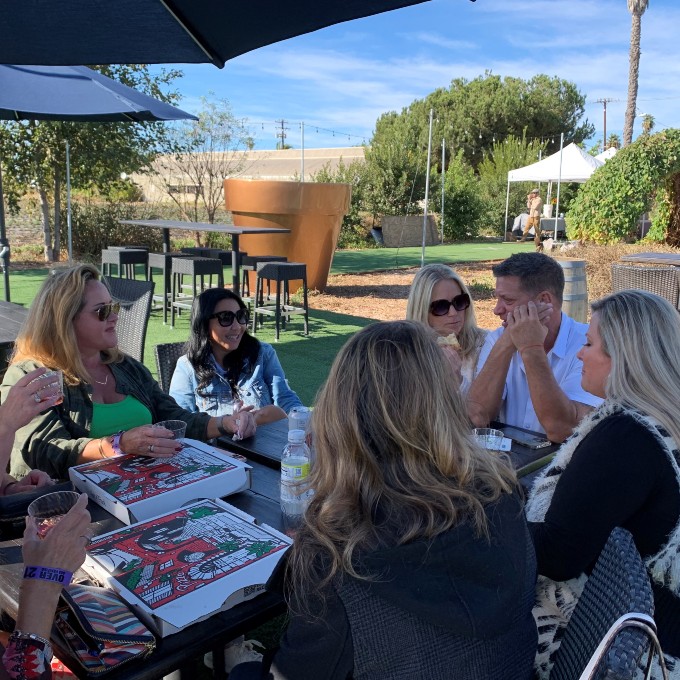 Group enjoying food and wine