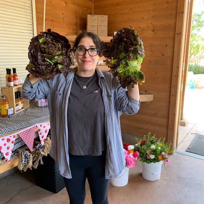 Woman holding lettuce