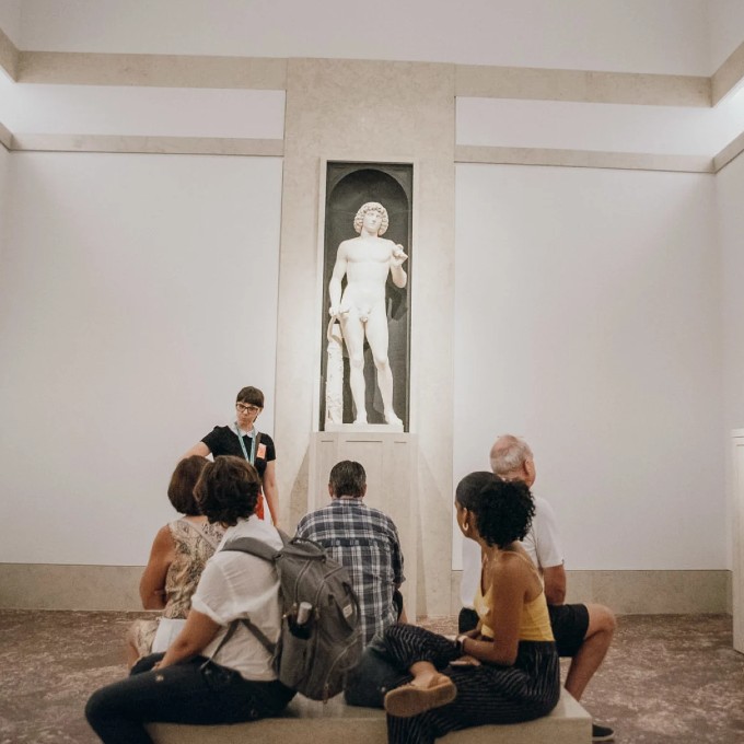 Group Admiring Statue