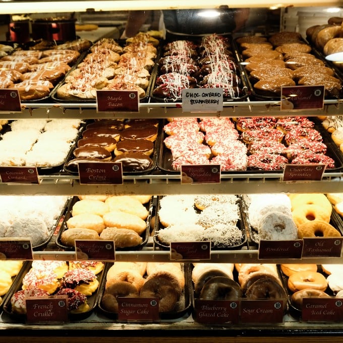 Variety of Donuts in Display Case