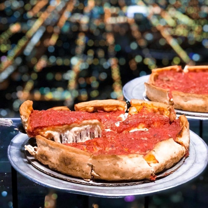 Deep dish pizza being served