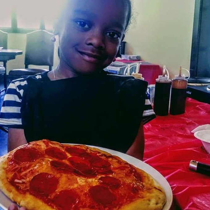 Kid with pizza