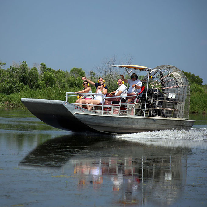 Group on Airboat Gliding on Water