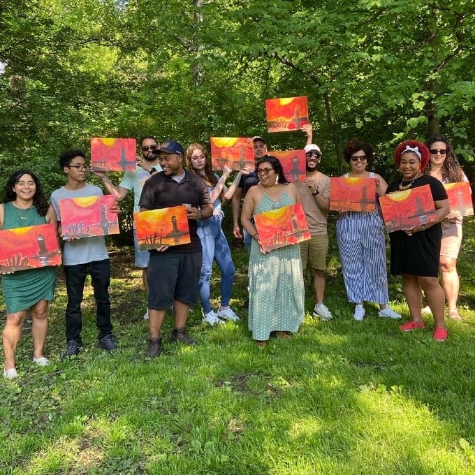 Group Showing Completed Artwork Outside