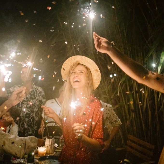 Group with drinks and sparklers