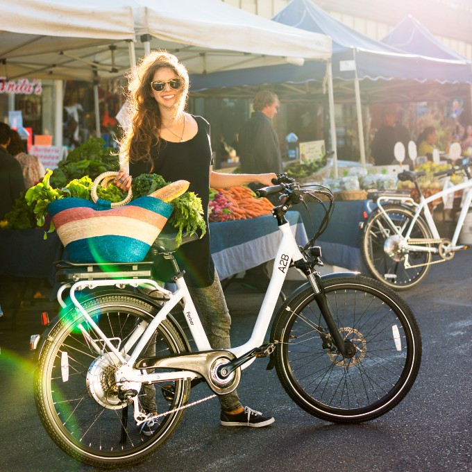 Girl with bike at farmers market