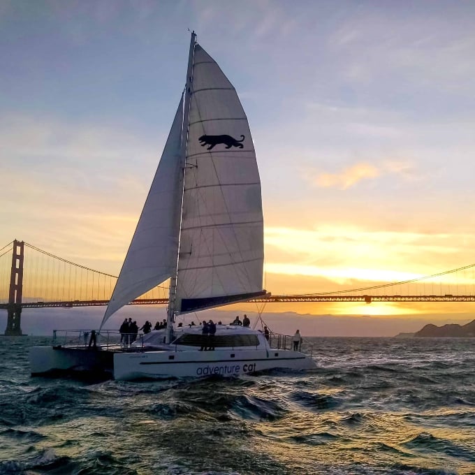 Boat sailing at sunset