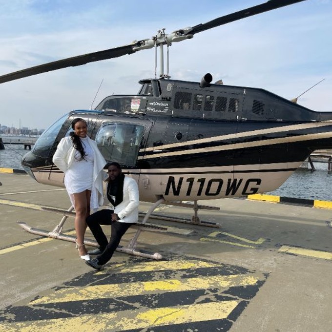 Couple in Front of Helicopter 