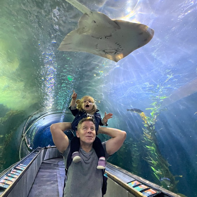 Father and child below sting ray