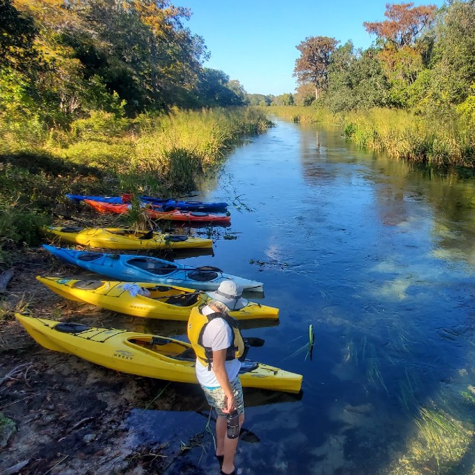 Multiple kayaks in water